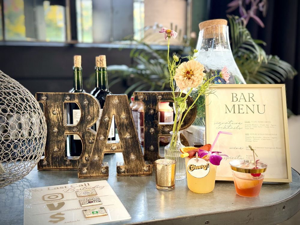 Adina pouring a cocktail at an outdoor event